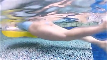 A woman with a dazzling swimsuit is popping