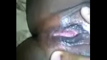 Ebony babe plays with her wet pussy