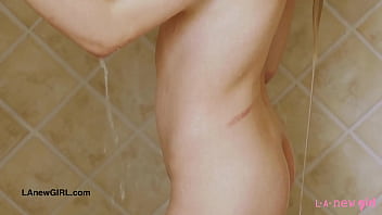 Striking blonde bombshell enjoys a sensual bath