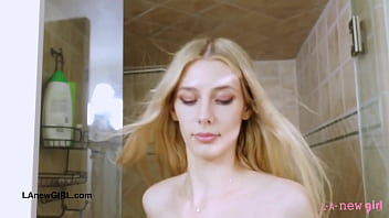 Striking blonde bombshell enjoys a sensual bath