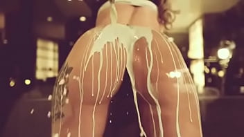 Sexy model pouring milk on her butts porn video