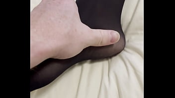 Boy rubs my feet in my new stockings