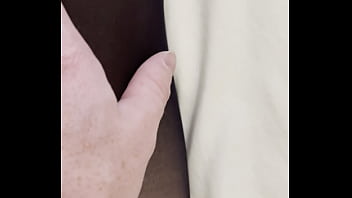 Boy rubs my feet in my new stockings