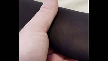 Boy rubs my feet in my new stockings