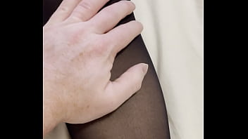 Boy rubs my feet in my new stockings