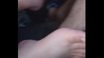 She plays with my dick with feet