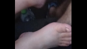 She plays with my dick with feet