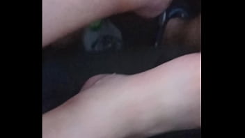 She plays with my dick with feet