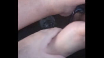 She plays with my dick with feet
