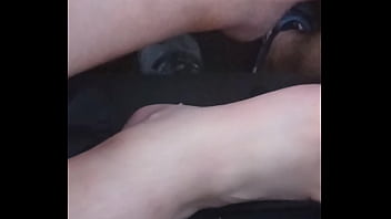 She plays with my dick with feet