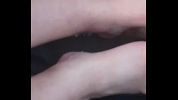 She plays with my dick with feet