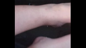 She plays with my dick with feet