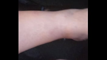 She plays with my dick with feet