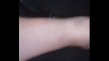 She plays with my dick with feet