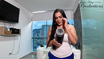 The cleaning girl helps him with his new toy by sucking him