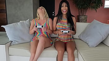 Brunette girl and blonde girl eat each other's pussies while playing video games