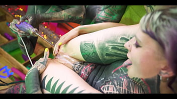 Tattooed girl gets her ass filled with cum compliments of punk girls