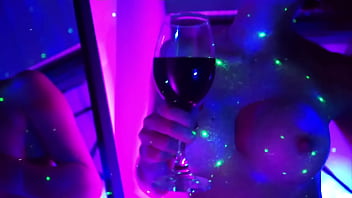 Beautiful redhead rubs her body on neon lights