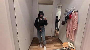 Camera in a public fitting room nice brunette tries on underwear Camera in a public fitting room nice brunette tries on underwear