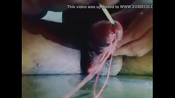 Insert stick in penis and getting wet