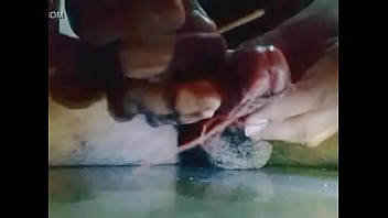 Insert stick in penis and getting wet