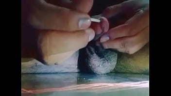 Insert stick in penis and getting wet