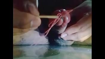 Insert stick in penis and getting wet