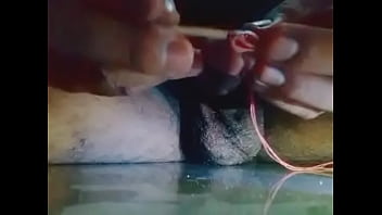 Insert stick in penis and getting wet