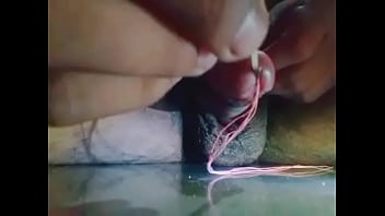 Insert stick in penis and getting wet