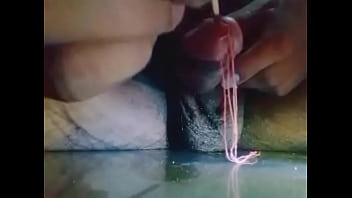 Insert stick in penis and getting wet