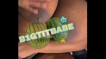 Giant tits playing on floor with toy