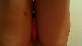 Brunette with glasses plays with a dildo and her fingers