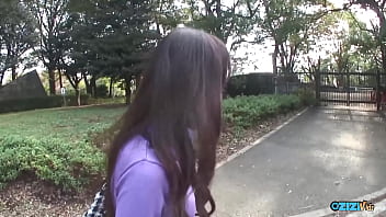 A woman in the rear seat of a vehicle engaged in oral sex with a large penis