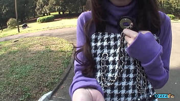 A woman in the rear seat of a vehicle engaged in oral sex with a large penis