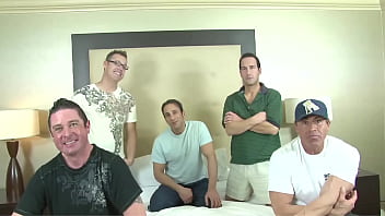 Surrounded by several men she sucks as many cocks as she can and then gets fucked and