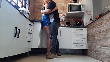 She talks to the cuckold on the phone while her lover kisses her