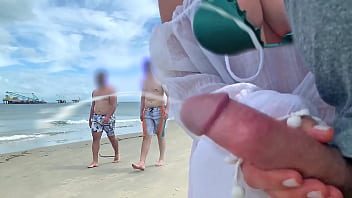Busty milf takes stranger's cock out of pants right on the beach Busty milf takes stranger's cock out of pants right on the beach