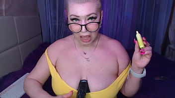 A cool busty vulgar mature whore in glasses with a ponytail on her head