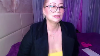 A cool busty vulgar mature whore in glasses with a ponytail on her head