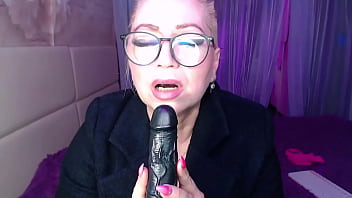 A cool busty vulgar mature whore in glasses with a ponytail on her head