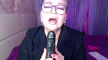 A cool busty vulgar mature whore in glasses with a ponytail on her head