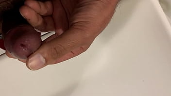 Brown guy masturbating in bathroom