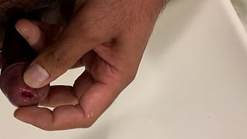 Brown guy masturbating in bathroom
