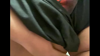 Teen rubbing tits while pissing