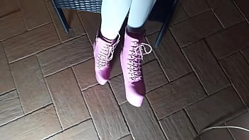 Sitting on a chair in pantyhose and high heeled boots Sitting on a chair in pantyhose and high heeled boots