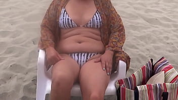 On the beach stepmom shows off and loves making cocks hard