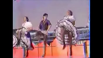 Girls dance and kick on stage showing upskirts