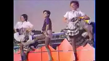 Girls dance and kick on stage showing upskirts