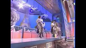 Girls dance and kick on stage showing upskirts