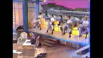 Girls dance and kick on stage showing upskirts